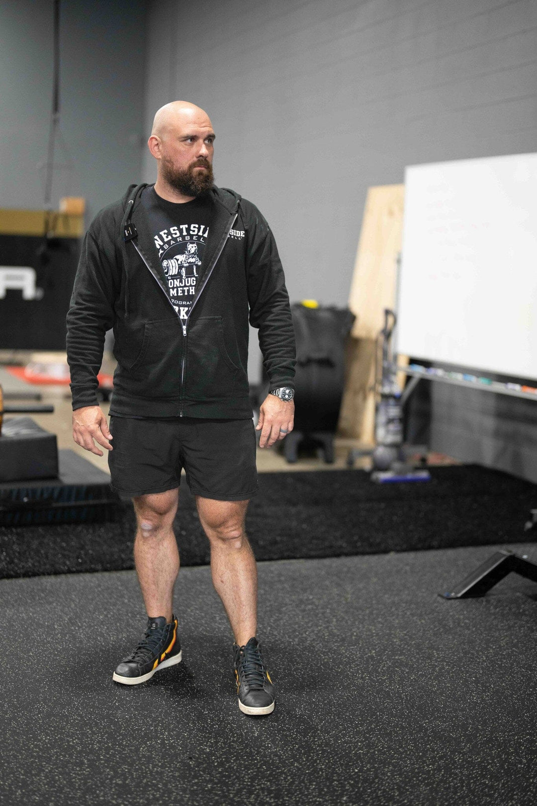 Tom Barry man  in westside barbell athletic wear standing in a gym setting