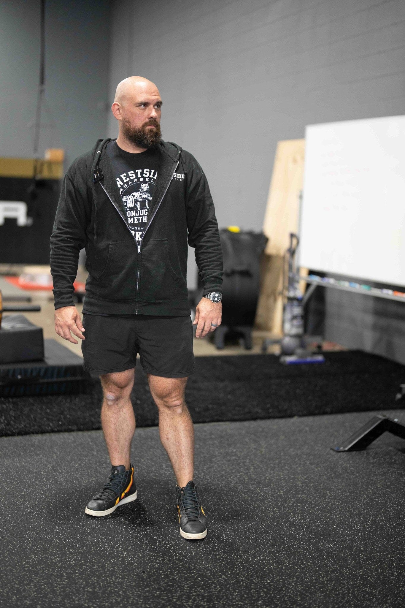 Tom Barry man  in westside barbell athletic wear standing in a gym setting