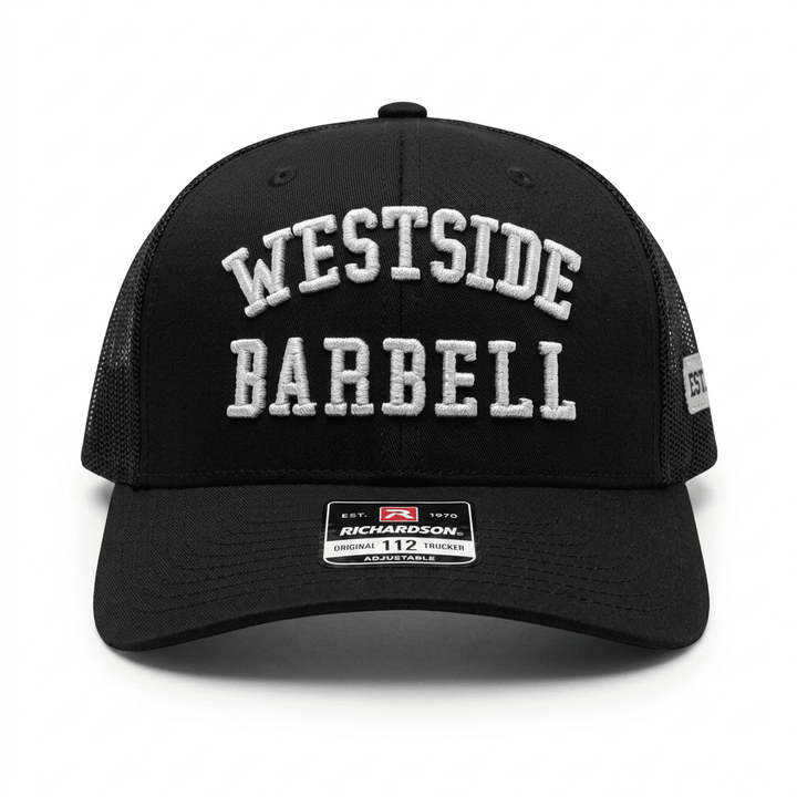 Westside Barbell EST. 1972 black trucker snapback shown from the front with white WESTSIDE BARBELL embroidery