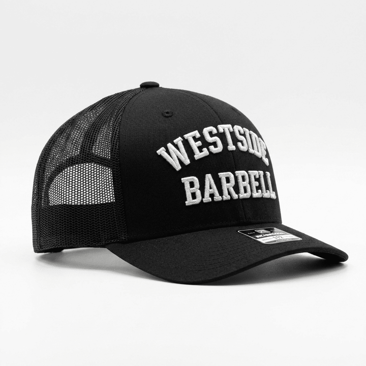 Three-quarter view of the Westside Barbell EST. 1972 black trucker snapback with embroidered front logo